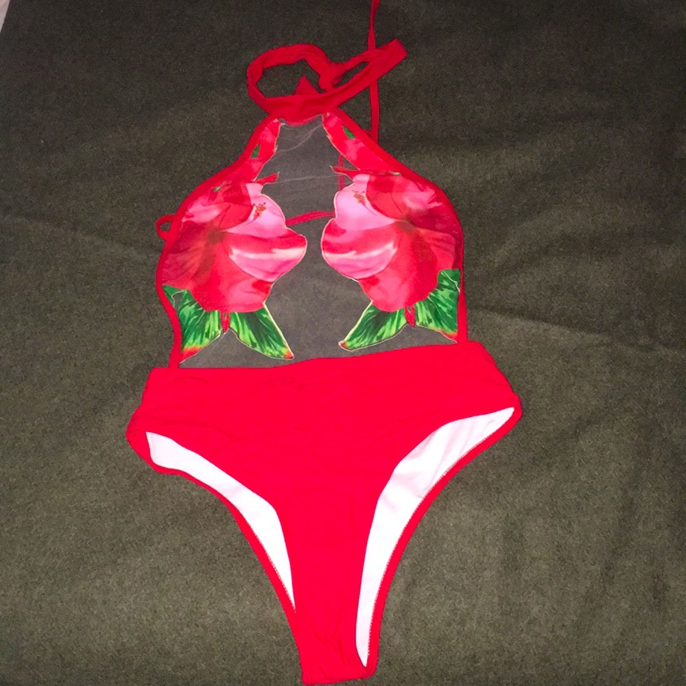 Never worn,unique mesh padded flower swimsuit, wears like a bikini